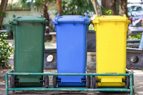 Office exterior showing commercial waste bins near a business property