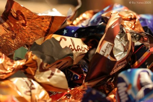 Containerised commercial waste being segregated for recycling at a collection point